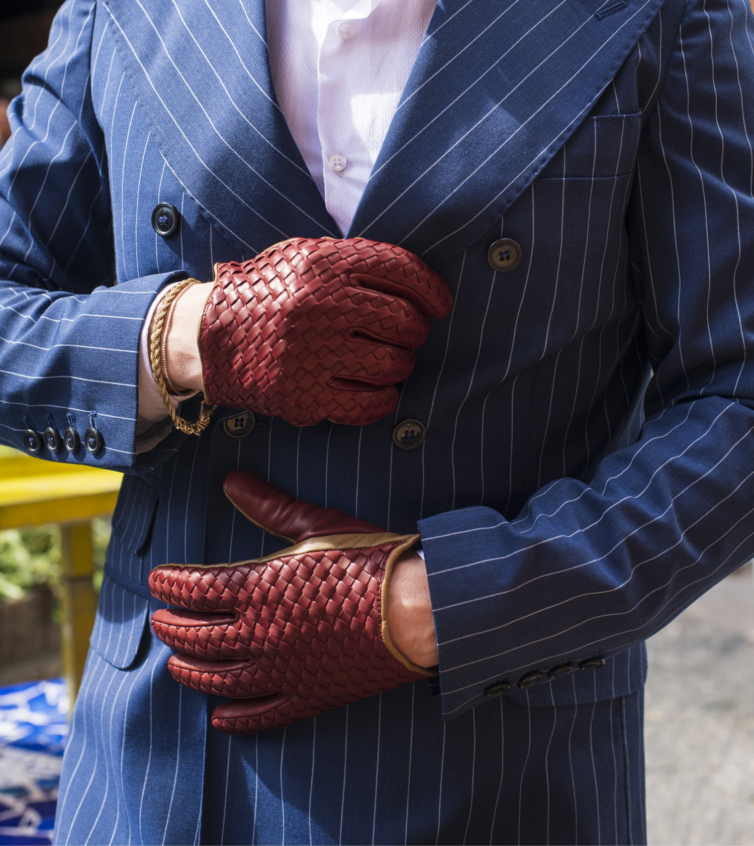 Guanti da uomo intrecciati in vera pelle metis foderati in cashmere.