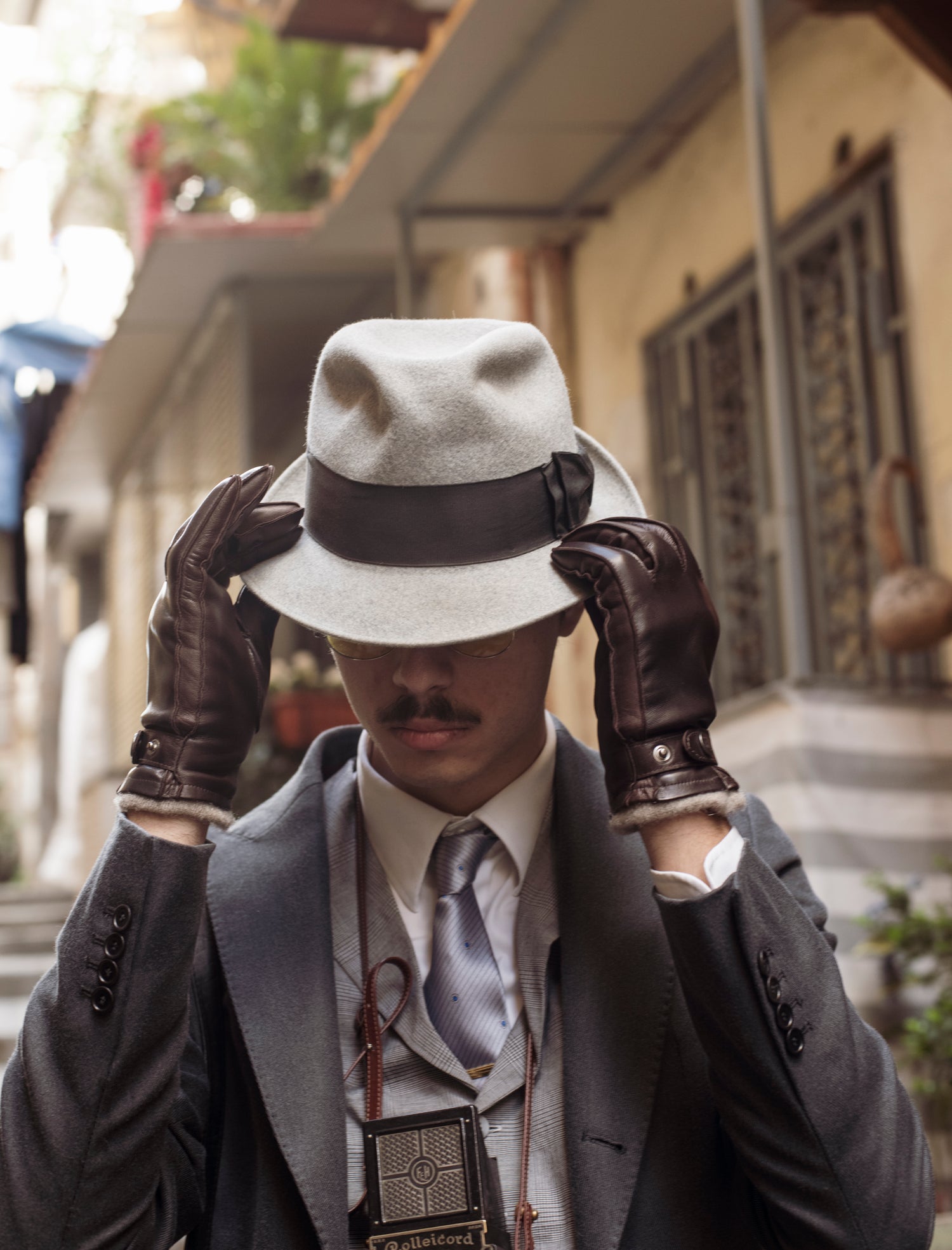 Guanti da uomo in vera pelle metis con cinturino foderati in cashmere